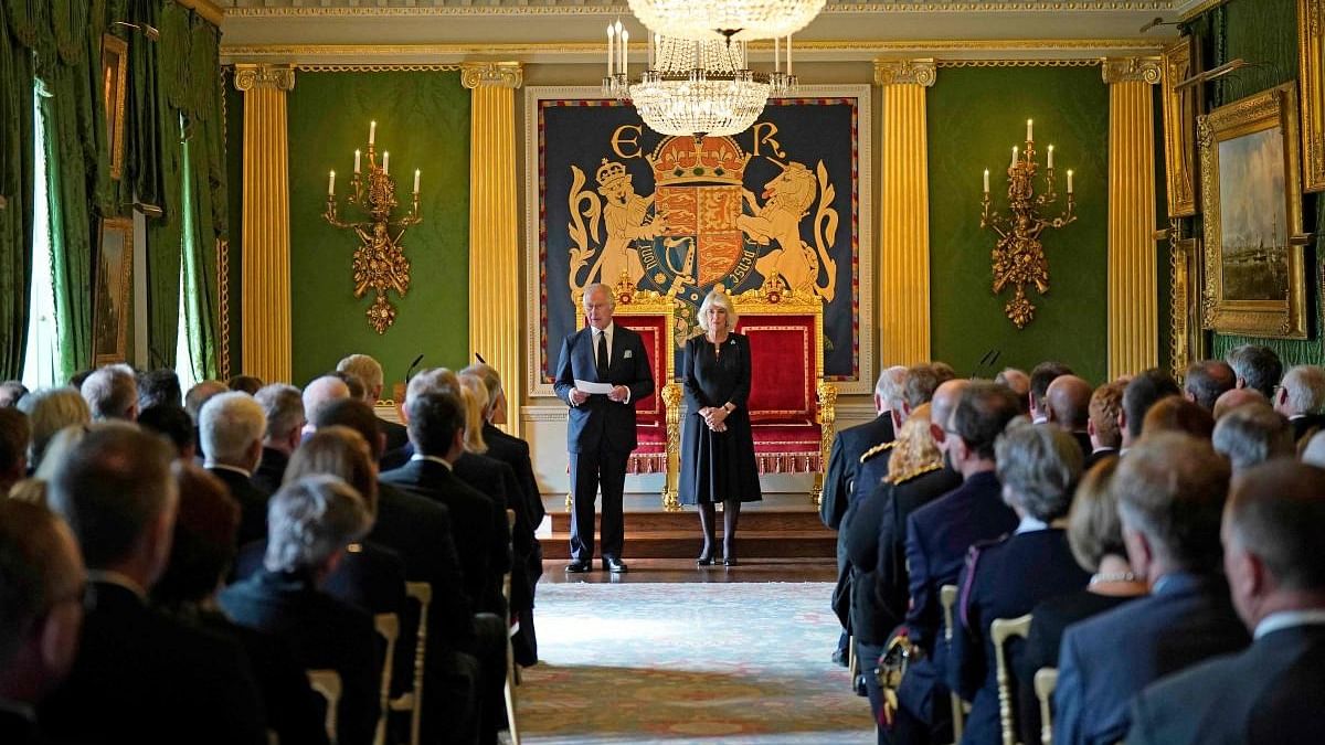 Britain's King Charles III, flanked by Britain's Camilla, Queen Consort, makes a speech after receiving a message of condolence following the death of his mother Queen Elizabeth II, at Hillsborough Castle in Belfast. Credit: AFP Photo