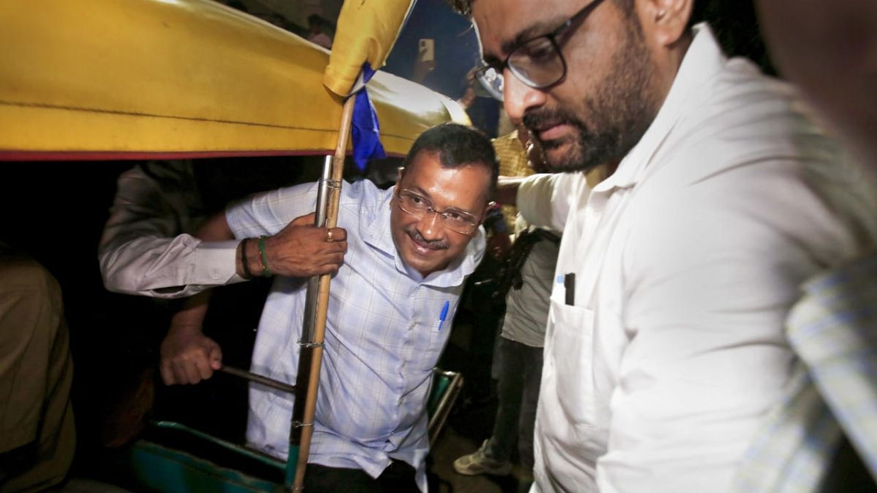 Delhi Chief Minister Arvind Kejriwal arrives to have dinner at the residence of auto rickshaw driver Vikram Dantani, in Ahmedabad. Credit: PTI Photo