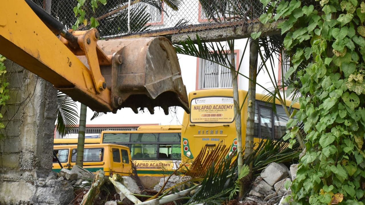 BBMP officials pulled down a portion of the Nalapad Academy in Mahadevapura on Tuesday. Credit: DH Photo