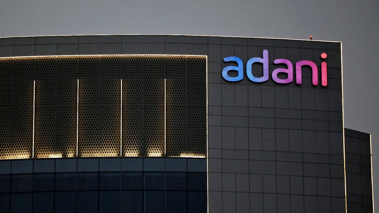 The logo of the Adani Group is seen on the facade of one of its buildings on the outskirts of Ahmedabad, India, April 13, 2021. Credit: Reuters File Photo