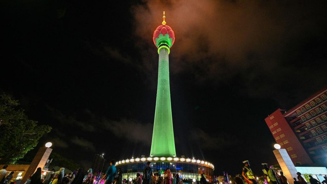 People visit the Sri Lankan 'white elephant' Chinese-built Lotus Tower after it was opened for public in Colombo. Credit: AFP Photo