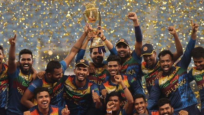 Sri Lanka's players celebrate with the Asia Cup trophy. Credit: AFP File Photo