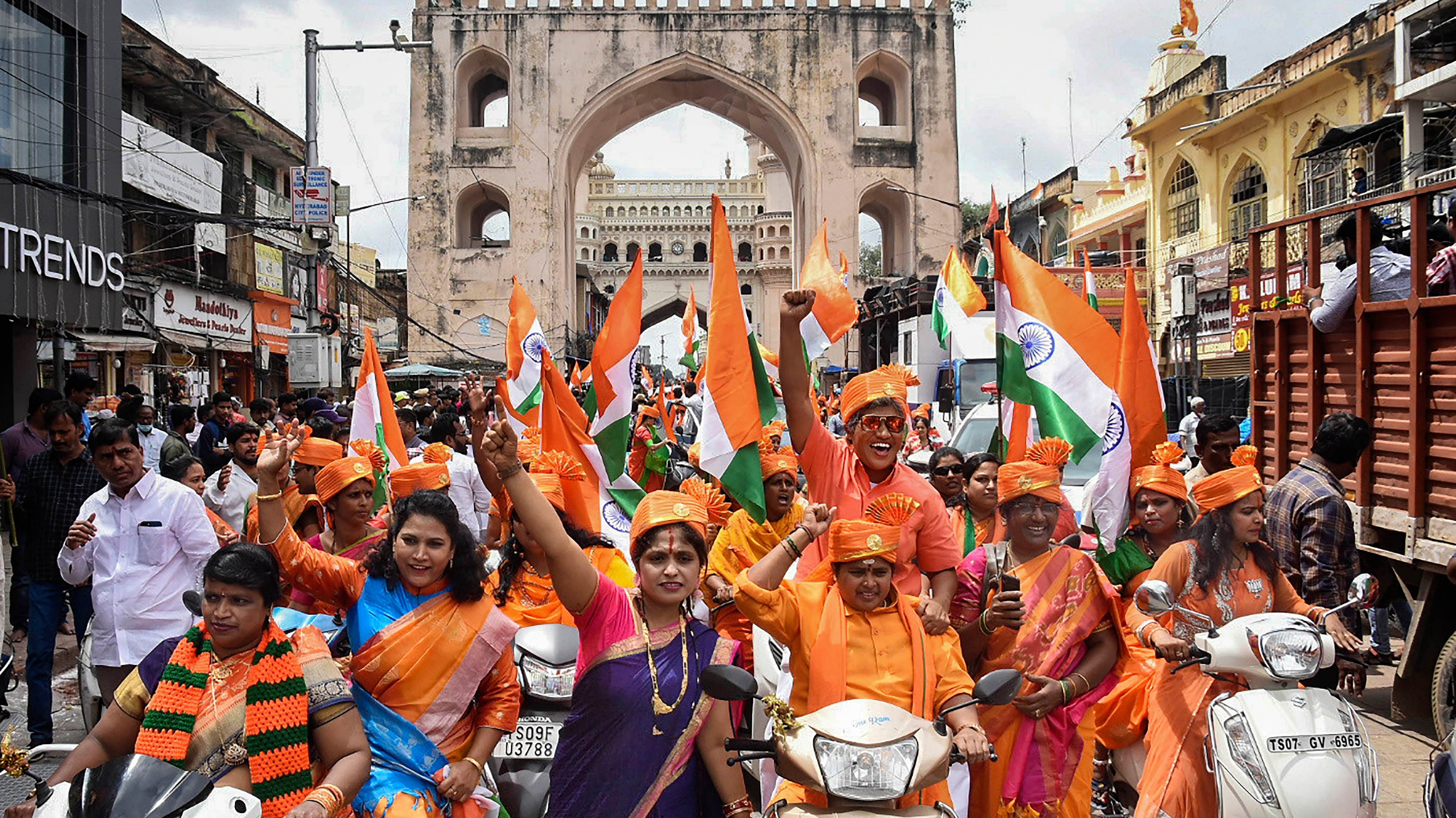 BJP Mahila Morcha activists participate in a bike rally organised as part of the upcoming 'Hyderabad Liberation Day' celebrations, near Charminar in Hyderabad. Credit: PTI File Photo