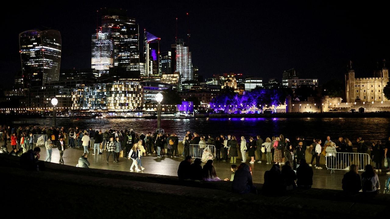 People queue to pay their respects to Britain's Queen Elizabeth following her death, in London. Credit: Reuters Photo