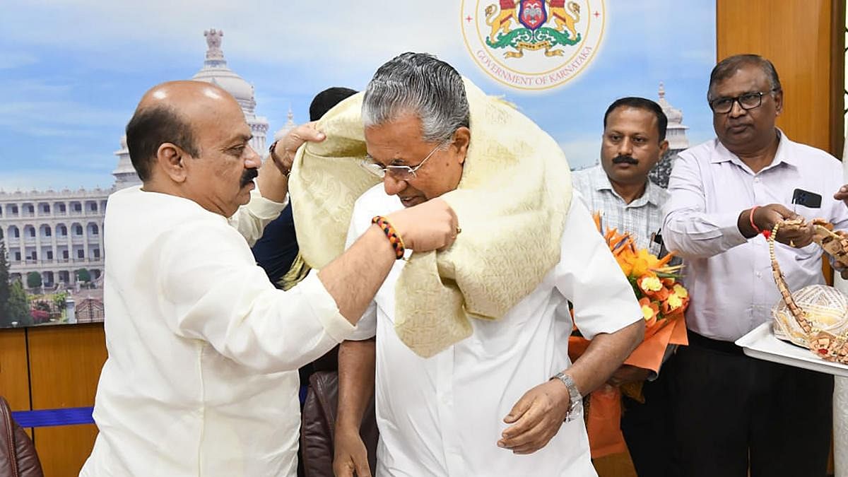 Karnataka Chief Minister Basavaraj Bommai felicitates Kerala Chief Minister Pinarayi Vijayan during their meeting, in Bengaluru. Credit: PTI Photo