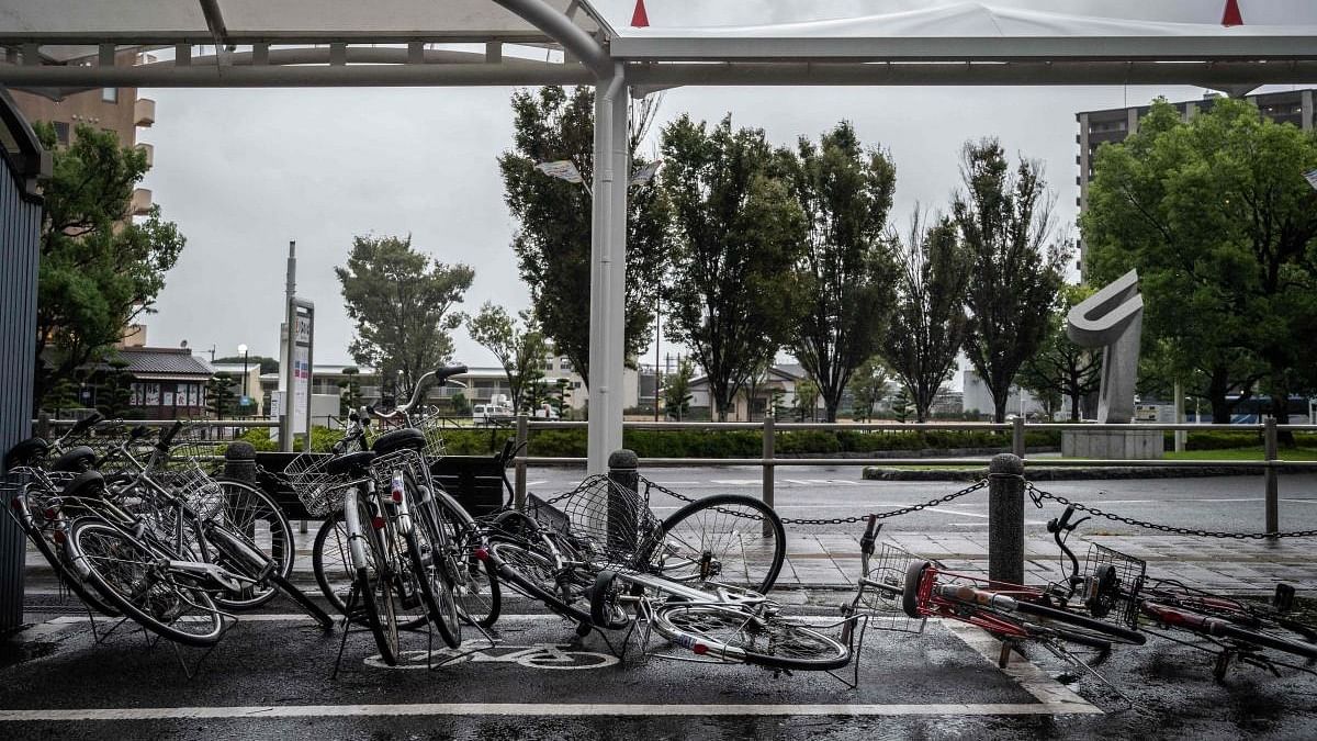 This picture shows fallen bicycles amid strong winds as Typhoon Nanmadol approaches Izumi, Kagoshima prefecture. Credit: AFP Photo