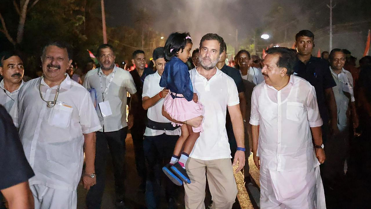Congress leader Rahul Gandhi with a child during the party's Bharat Jodo Yatra in Alappuzha district, Kerala, September 17, 2022. Credit: PTI Photo