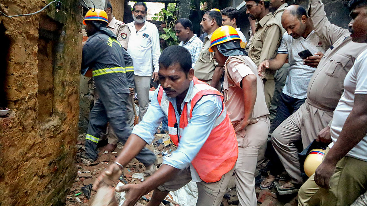 Rescuers attempt to extract survivors in Uttar Pradesh's Deoria after the roof of a two-storey building collapsed due to rains, September 19, 2022. Credit: PTI Photo