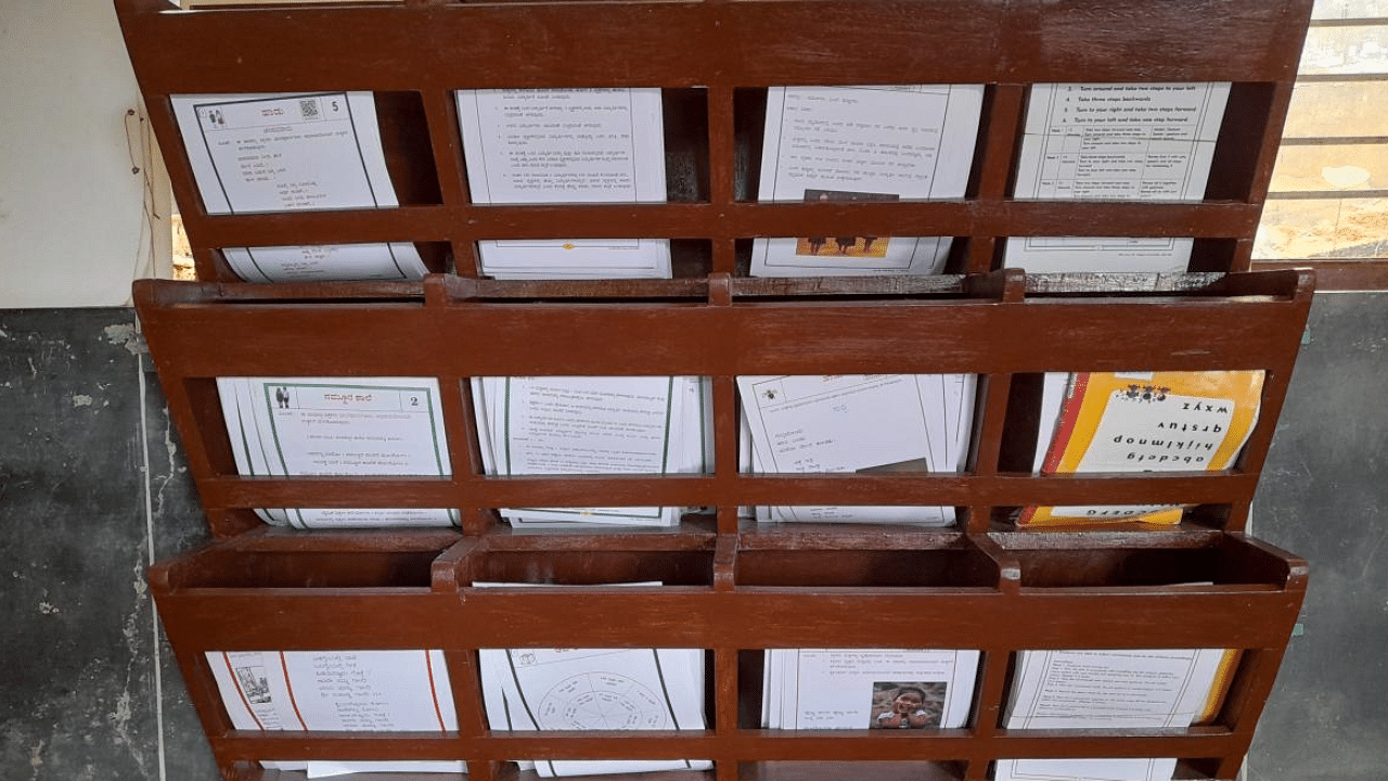 The book shelves made out of old desks and benches in Dakshina Kannada Zilla Panchayat Model Higher Primary School at Moodambailu. Credit: DH Photo