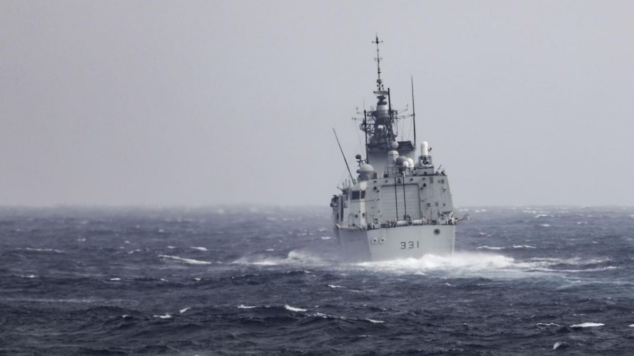 In this photo provided by U.S. Navy, The Royal Canadian Navy Halifax-class frigate HMCS Vancouver (FFH 331) transits the Taiwan Strait with guided-missile destroyer USS Higgins (DDG 76) while conducting a routine transit on Sept. 20, 2022. Credit: AP Photo