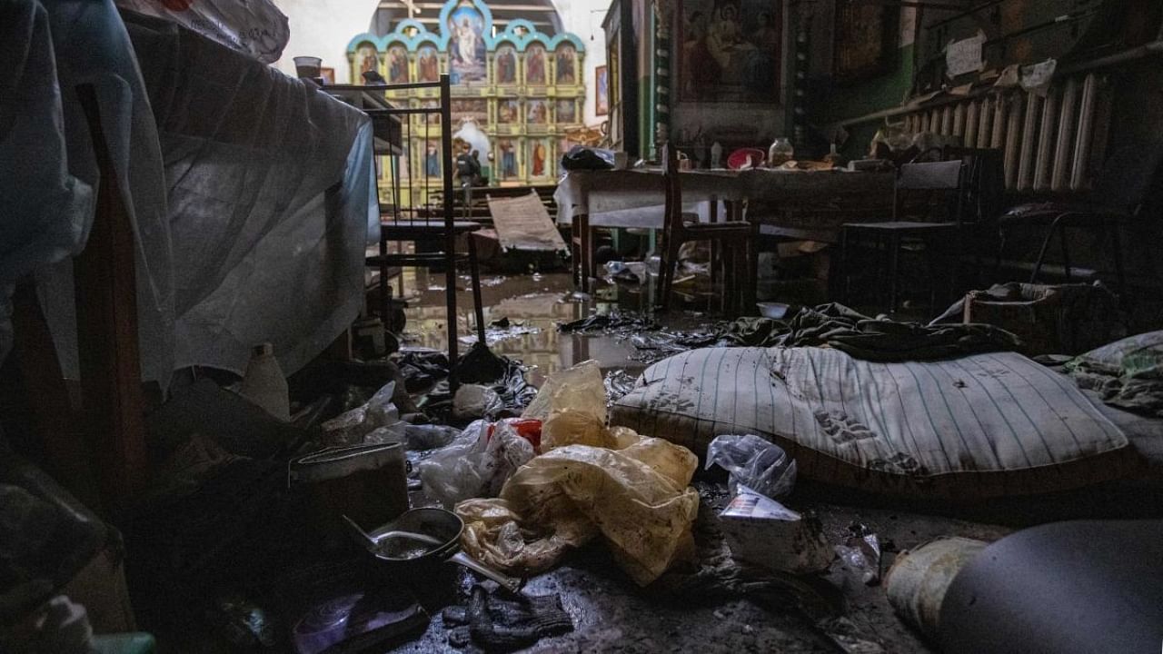 This photograph taken on September 20, 2022 shows inside a church that used by Russian troops as a makeshift hospital in Mala Komyshuvakha, near Izyum, Kharkiv region.  Credit: AFP Photo