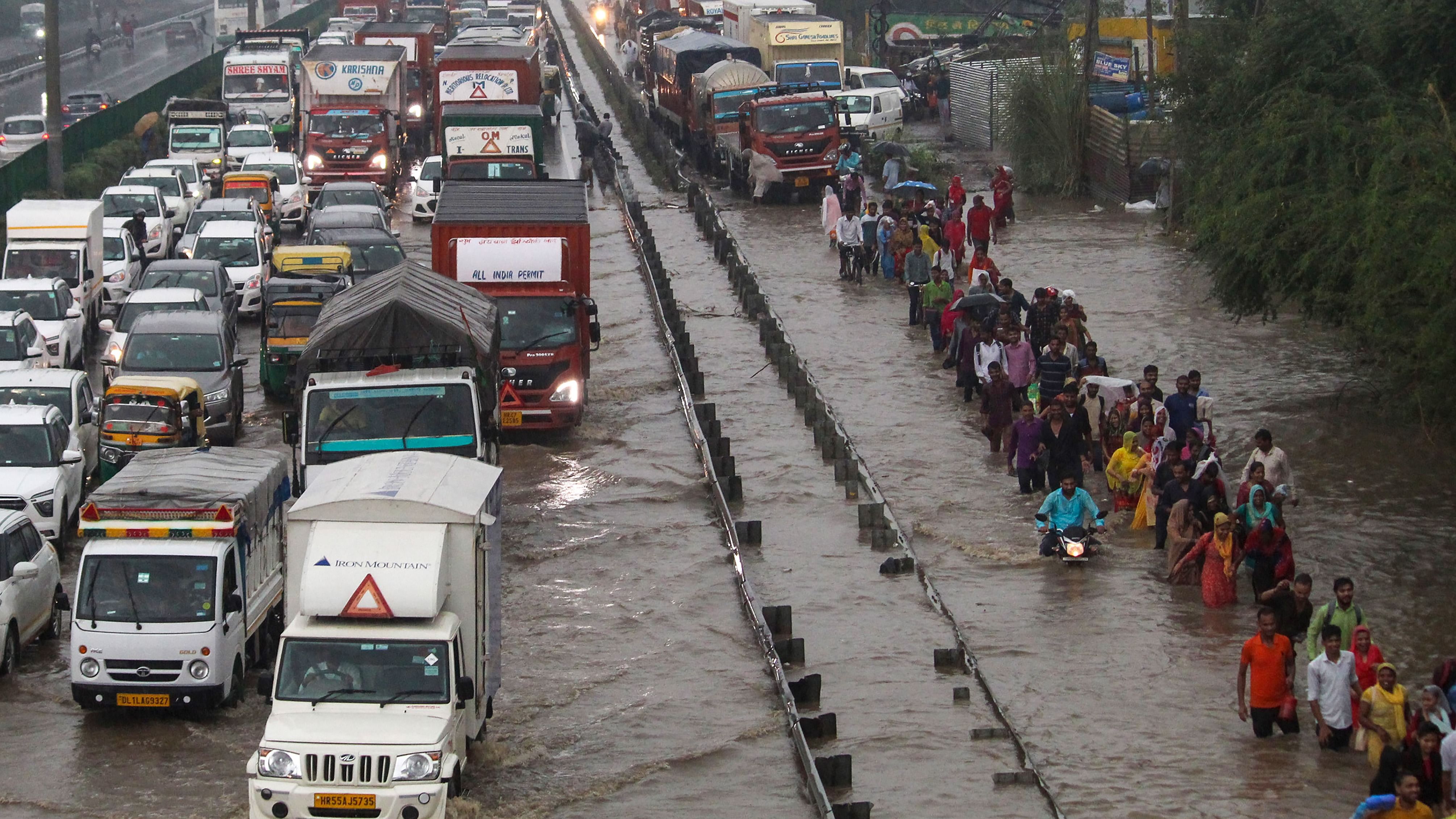 The Delhi Traffic Police Helpline received 23 calls related to traffic jam, seven regarding waterlogging and two related to uprooting of trees from various parts of the city. Credit: PTI Photo