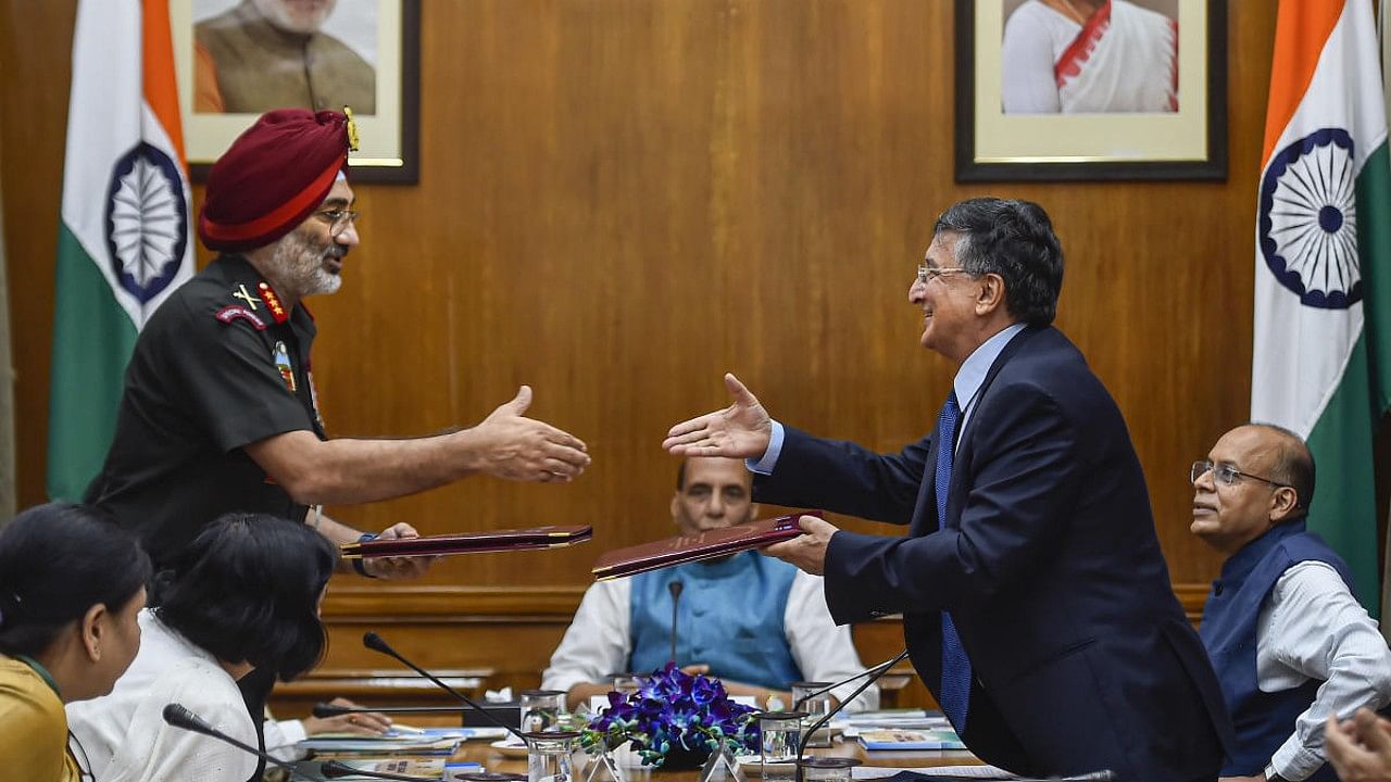 National Cadet Corps DG Gurbirpal Singh shakes hands with UNWEP Resident Representative Bishow Parajuli. Credit: PTI Photo