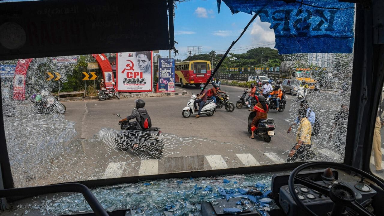Broken windshield of a Kerala State Road Transport Corporation bus after some miscreants threw stones on it, during the 'hartal' called by Popular Front of India (PFI) in protest against the nationwide arrest of its leaders by National Investigation Agency and Enforcement Directorate, in Thiruvananthapuram, Friday, Sept. 23, 2022. Credit: PTI Photo