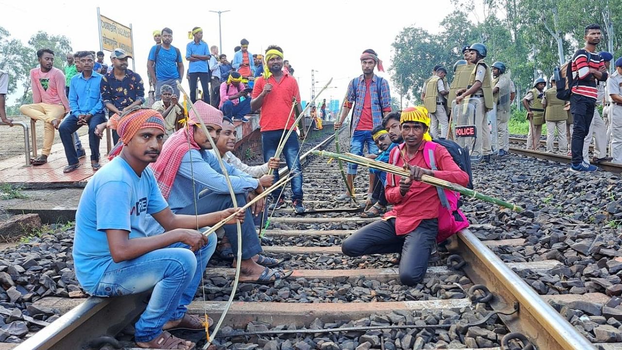 Agitators from the Kurmi community block railway tracks to press for their demand for Scheduled Tribe (ST) status, in West Medinipur district, Wedneday, September 21, 2022. Credit: PTI Photo
