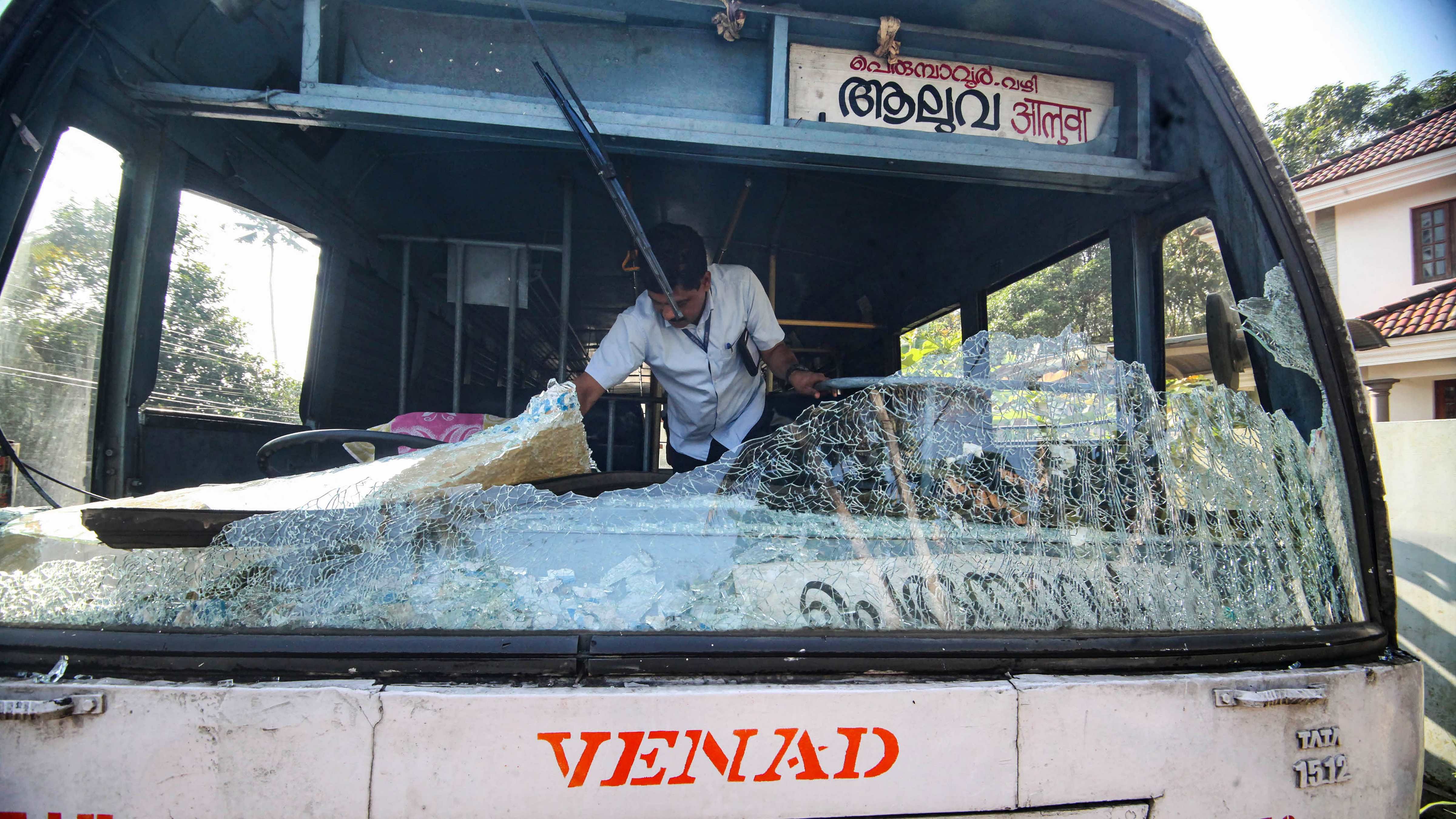 Broken windshield of a bus after some miscreants threw stones on it, during the 'hartal' called by PFI. Credit: PTI Photo