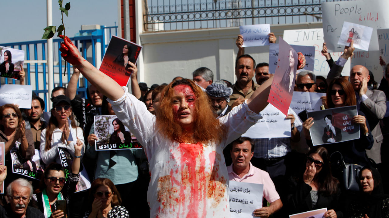 People take part in a protest following the death of Mahsa Amini in front of the United Nations headquarters in Erbil, Iraq September 24, 2022. Credit: Reuters Photo