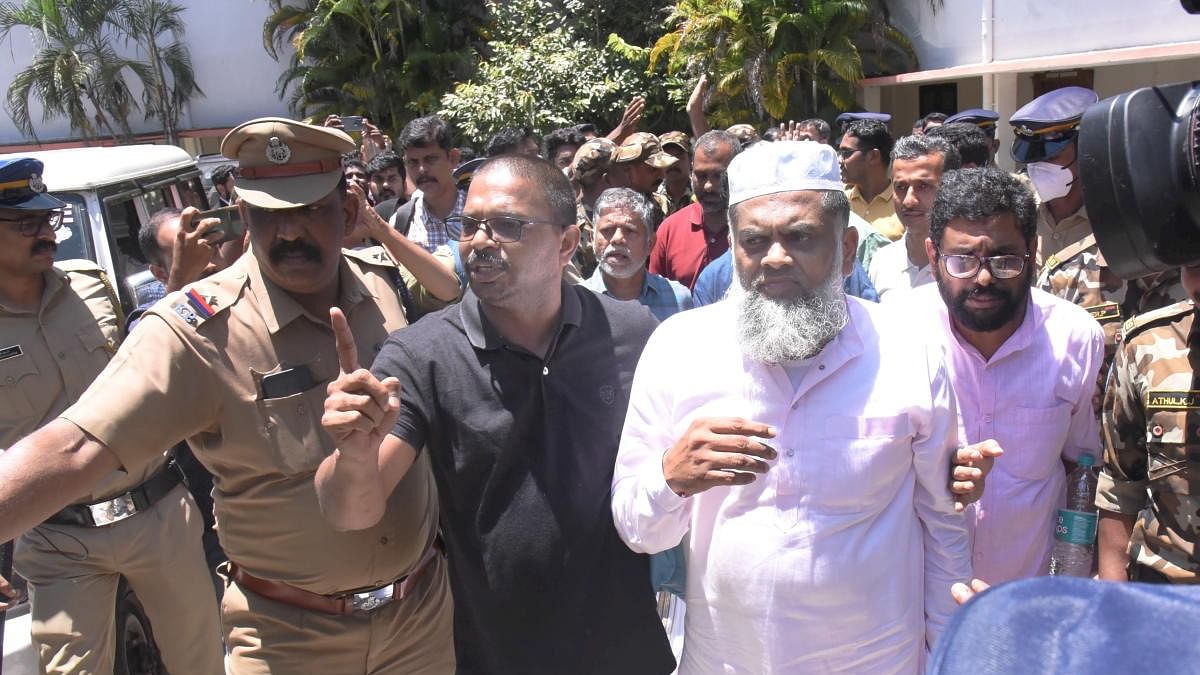 Popular Front of India (PFI) members Yahiya Thangal, Karamana Asharaf Maulavi and PK Usman after being produced before a court following a nationwide raid spearheaded by the National Investigation Agency (NIA) on Thursday, in Kochi. Credit: PTI Photo