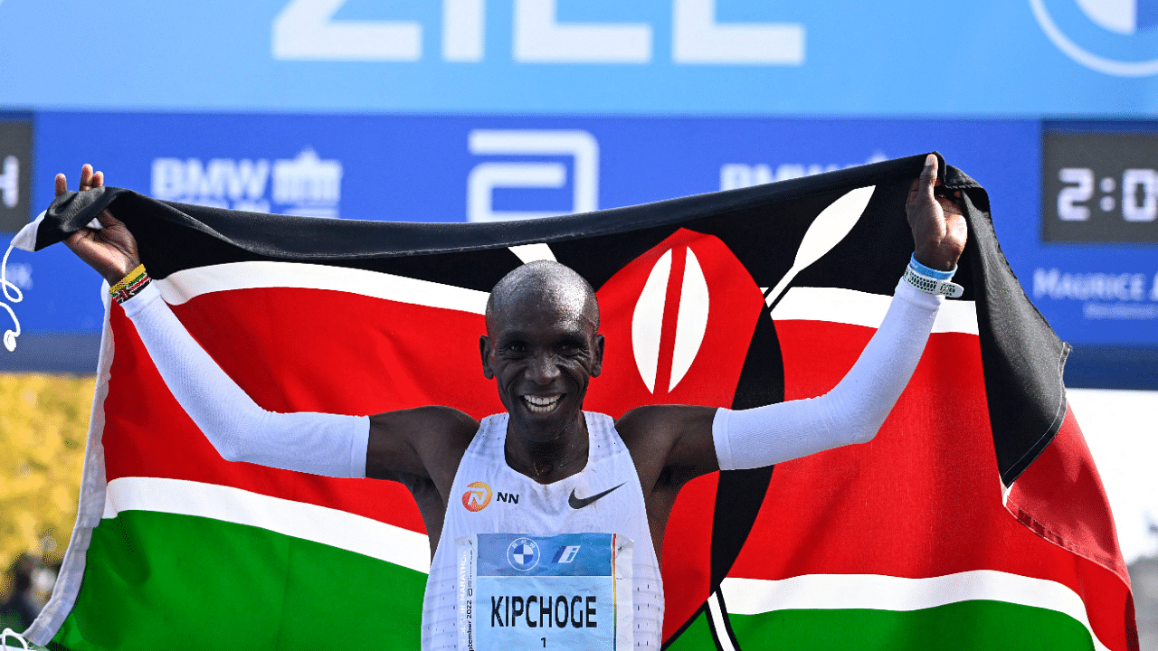 Kenya's Eliud Kipchoge celebrates after winning the Berlin Marathon race on September 25. Credit: AFP Photo