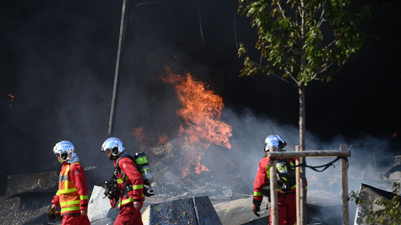 Firefighters work to put out a fire in a building at the 'Rungis International Market', south of Paris, on September 25, 2022. Credit: AFP Photo