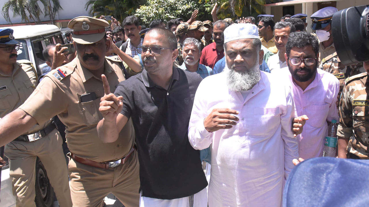 Popular Front of India (PFI) members Yahiya Thangal, Karamana Asharaf Maulavi and PK Usman after being produced before a court following a nationwide raid spearheaded by the National Investigation Agency. Credit: PTI Photo