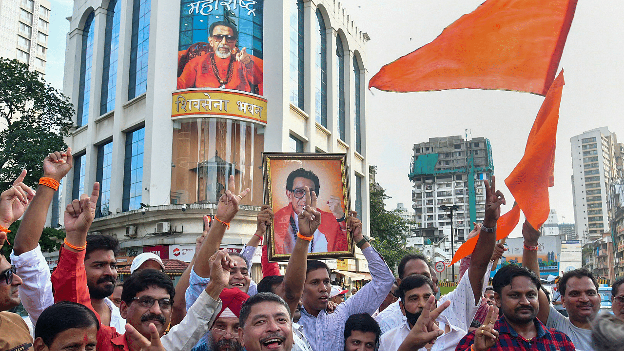  Shiv Sena party activists celebrate after the High Court directed the BMC to allow the Shiv Sena faction led by Uddhav Thackeray to hold a Dussehra gathering at Shivaji Park. Credit: PTI Photo