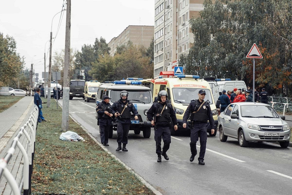 Policemen walk near the scene of a shooting in school No88 in Izhevsk on September 26, 2022. Credit: AFP Photo