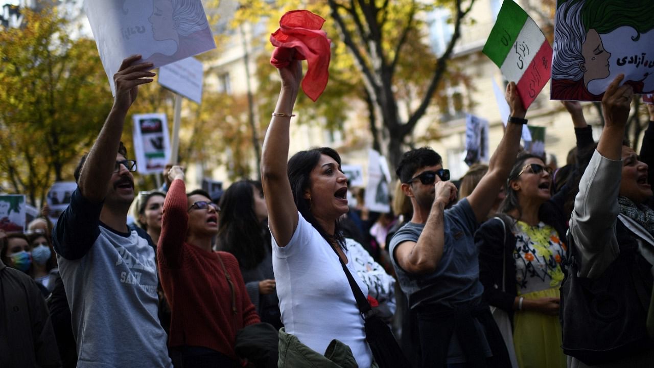 People take part in a demonstration in support of Iranian protesters. Credit: AFP Photo