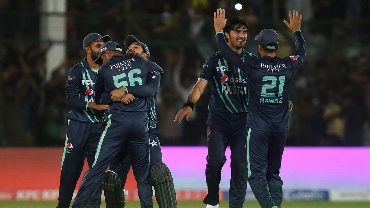 Pakistan's players celebrate their victory at the end of the fourth Twenty20 international cricket match between Pakistan and England at the National Cricket Stadium in Karachi. Credit: AFP Photo