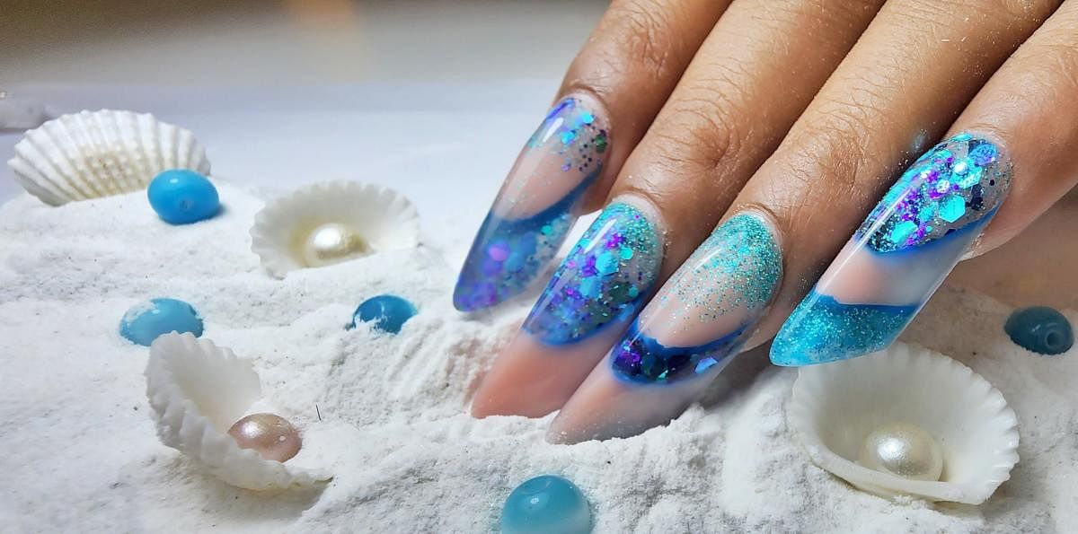 An increasingly popular 3D nail trend is inlay nails. This design by Ruchita Mhatre, owner of nail salon Nailarium, Mumbai, looks similar to an aquarium. Credit: Special arrangement