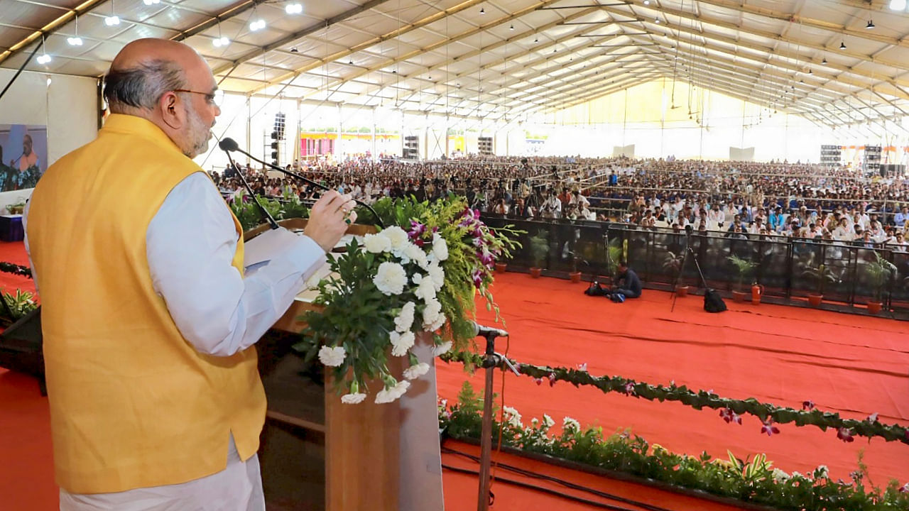 Amit Shah addresses the foundation stone laying ceremony of 350 bedded ESIC Hospital, at Sanand in Ahmedabad district, September 26, 2022. Credit: PTI Photo