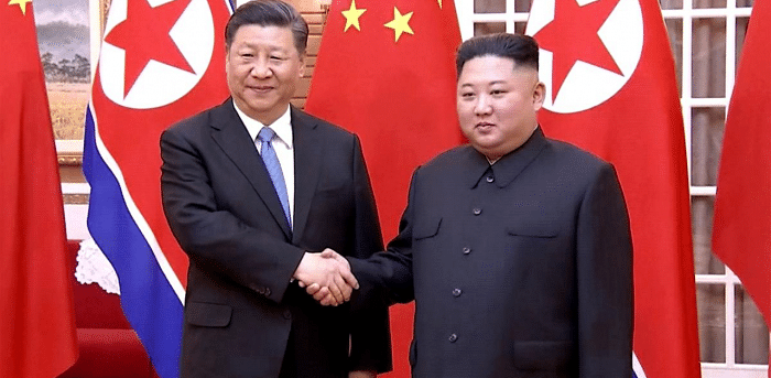 Chinese President Xi Jinping (L) with North Korean leader Kim Jong-un. Credit: AFP File Photo.