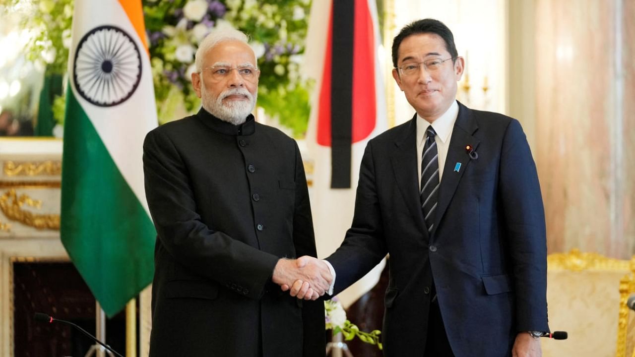 Prime Minister Narendra Modi poses for a photo with Japanese Prime Minister Fumio Kishida. Credit: Reuters Photo