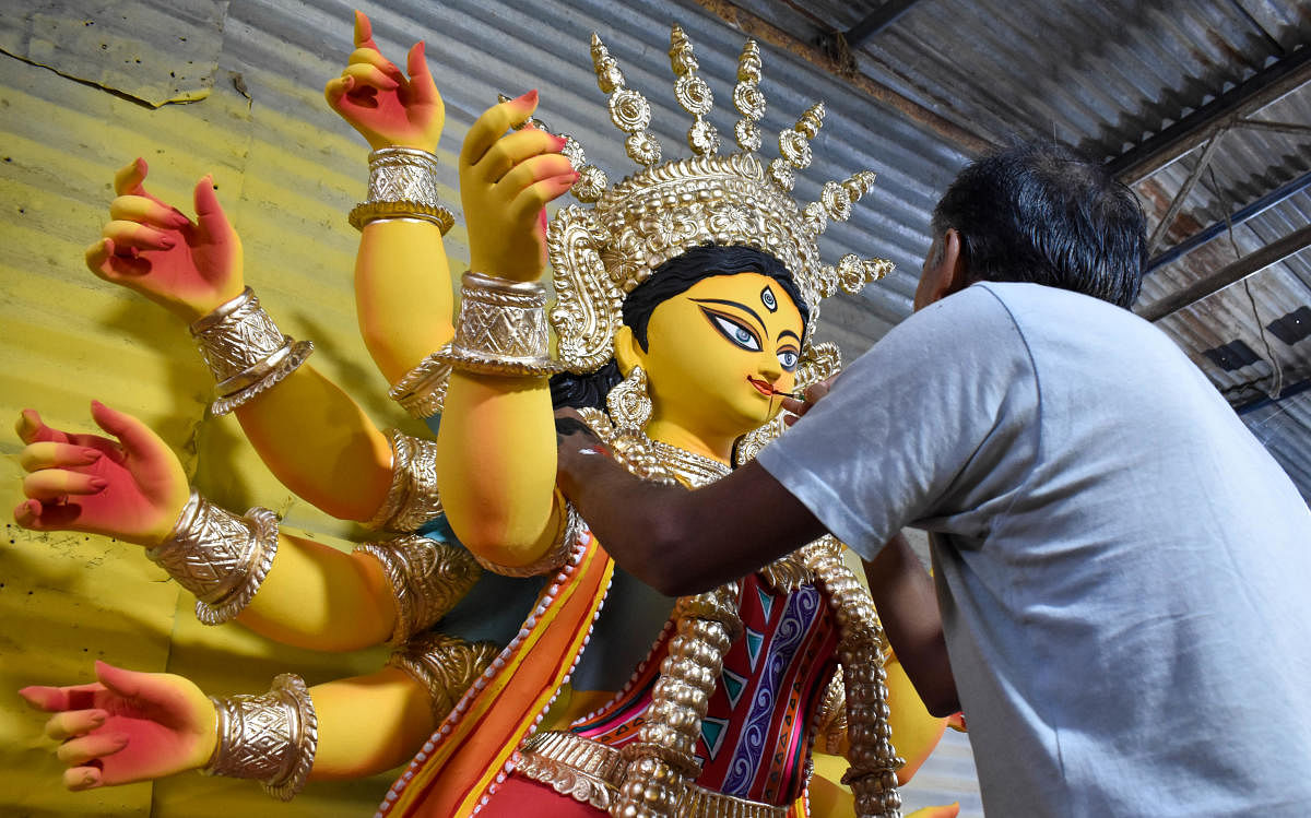 With Durga puja around the corner, artisans give finishing touches to idols at a workshop in Cox Town in Bengaluru. Credit: DH Photo/Rishita Khanna