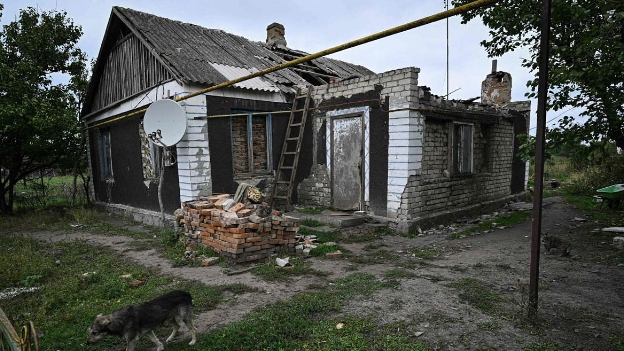 A photograph taken on September 27, 2022, shows a heavily damaged house in the recently liberated village of Vysokopillya, Kherson region, amid the Russian invasion of Ukraine. Credit: AFP Photo