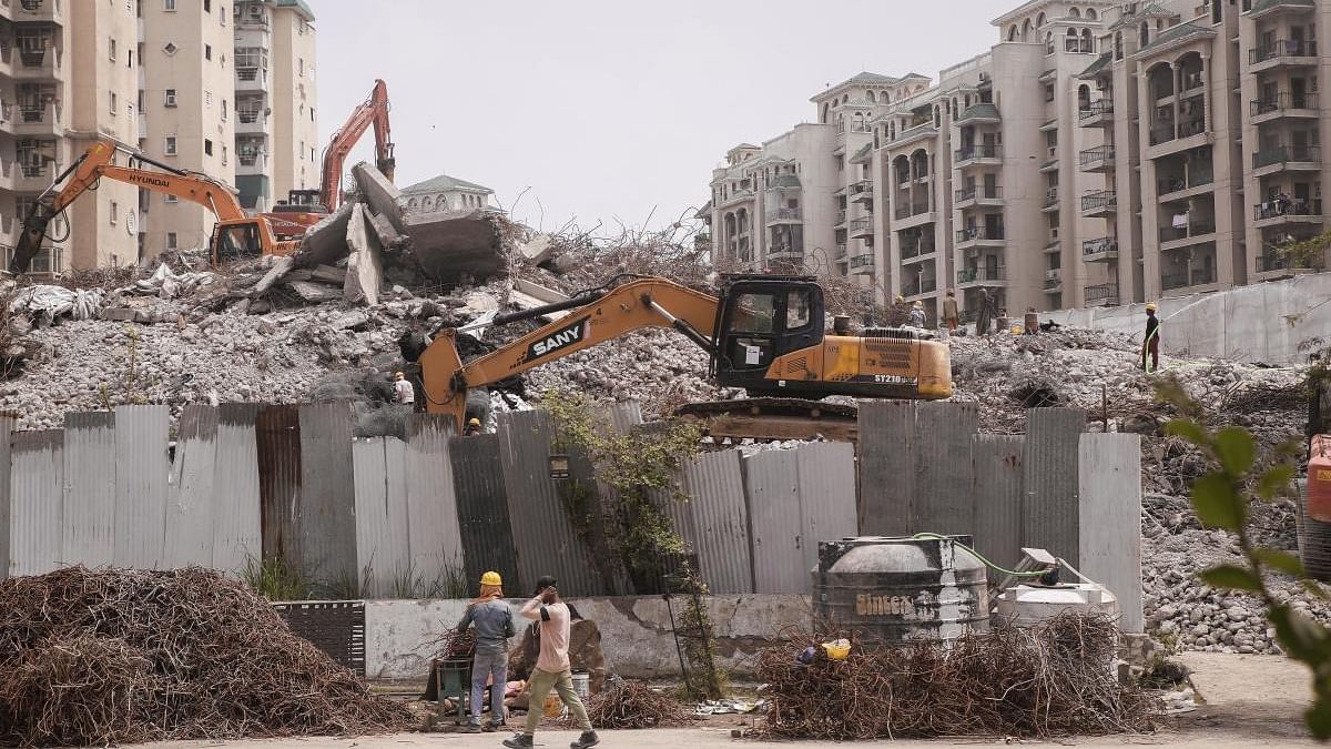 Debris clearance work underway at the site of the demolished twin towers of Supertech, in Noida. Credit: PTI file photo