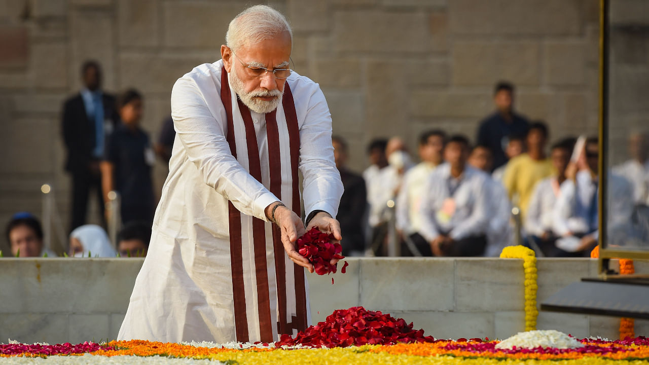 Prime Minister Narendra Modi pays homage to Mahatma Gandhi on the occasion of his birth anniversary, at Rajghat in New Delhi. Credit: PTI Photo