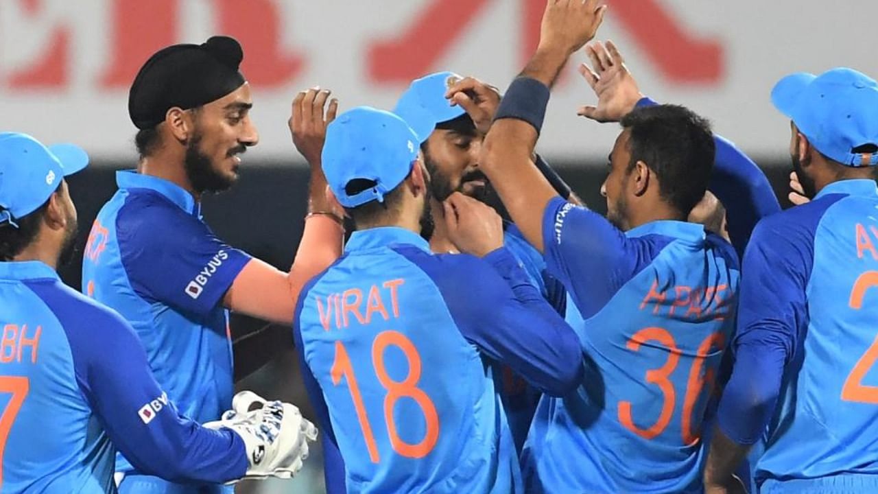 India's players celebrate after the dismissal of South Africa's Rilee Rossouw (not pictured) during the second Twenty20 international cricket match between India and South Africa at the Assam Cricket Association Stadium in Guwahati on October 2, 2022. Credit: AFP Photo