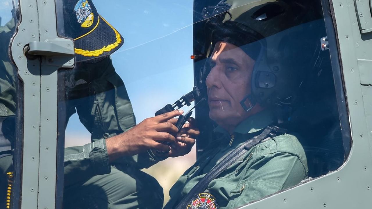 Defence Minister Rajnath Singh prepares for a sortie in the newly-inducted indigenously built Light Combat Helicopter (LCH) "Prachand", in Jodhpur. Credit: PTI Photo