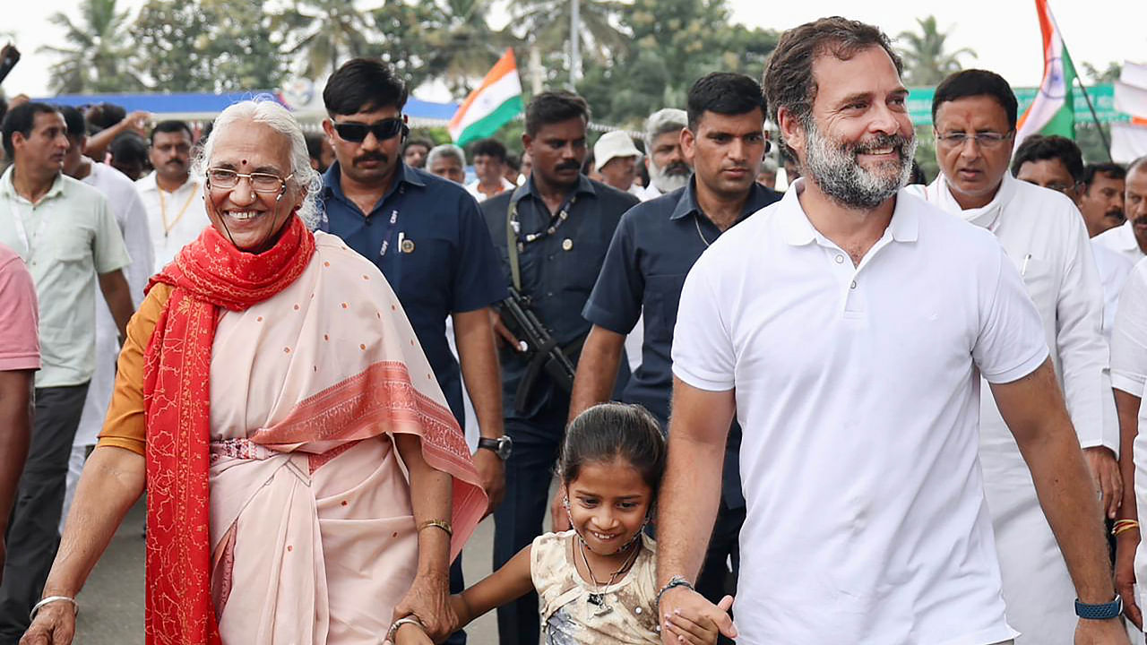 Congress leader Rahul Gandhi with a young supporter during the party's 'Bharat Jodo Yatra', in Mandya district, Monday, Oct. 3, 2022. Credit: PTI Photo