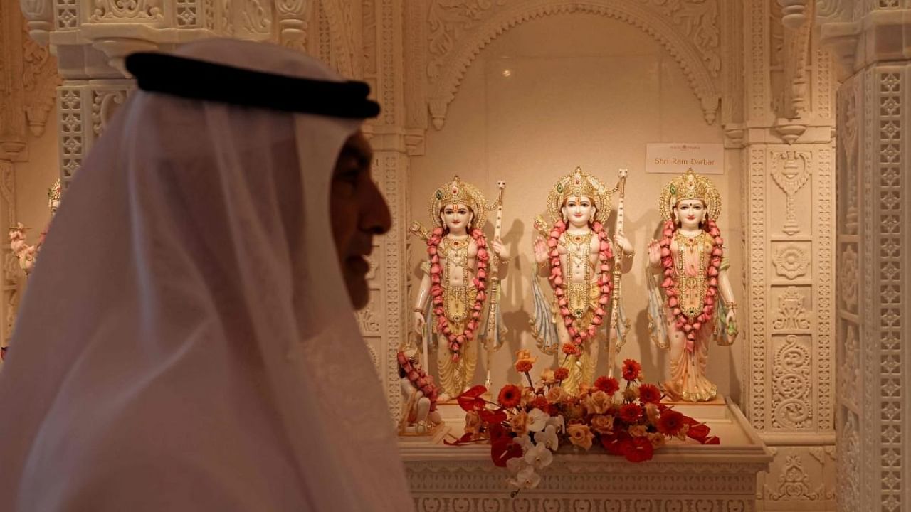 An Emirati man stands in front of Ram Darbar statue at the newly-inaugurated Hindu temple in Dubai's Jebel Ali neighbourhood. Credit: AFP Photo