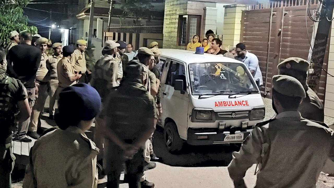 Police personnel with an ambulance outside the residence of Jammu and Kashmir's Director General (Prisons) Hemant K. Lohia after he was found murdered, in Jammu district, Monday night. Credit: PTI Photo