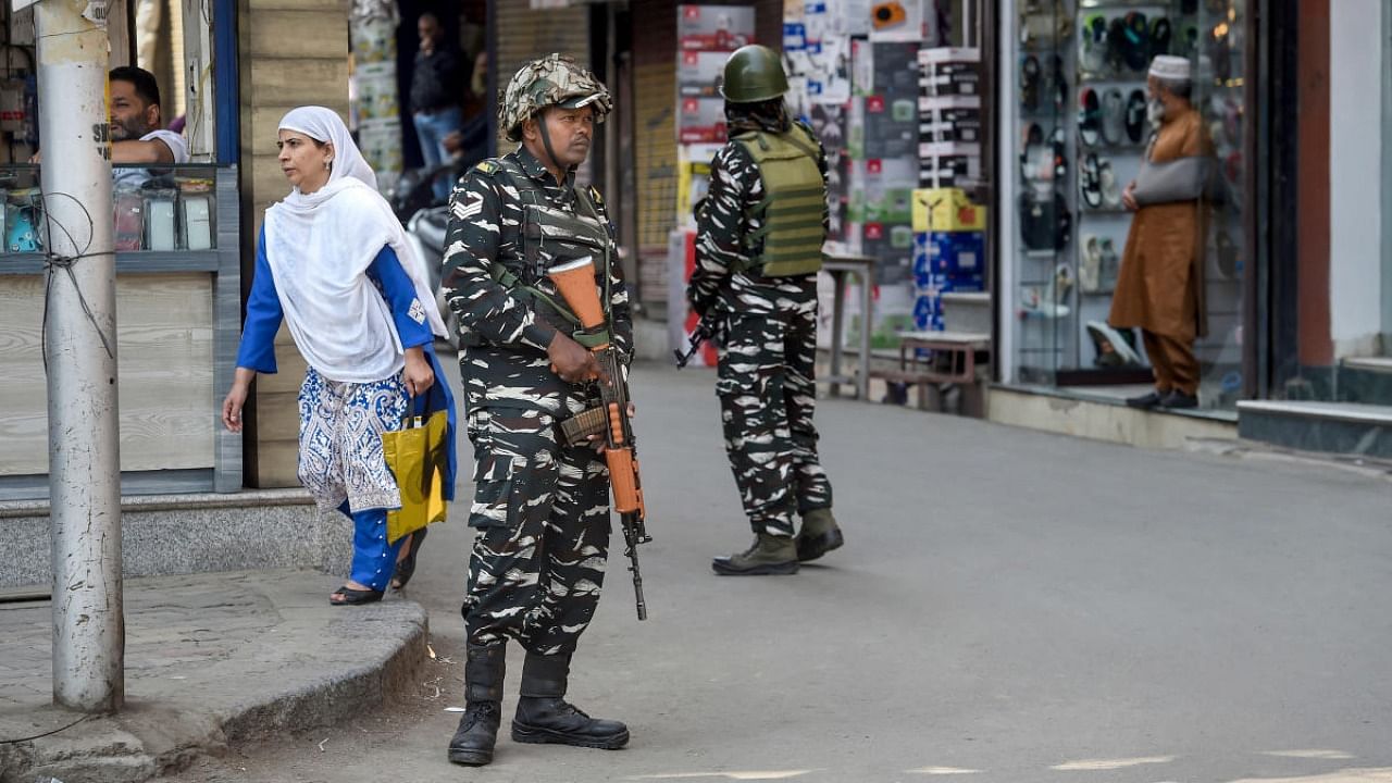 CRPF personnel guard in a street as security has been beefed up ahead of 3-day visit of Union Home Minister Amit Shah to Jammu and Kashmir, in Srinagar, Monday, Oct. 3, 2022. Credit: PTI Photo