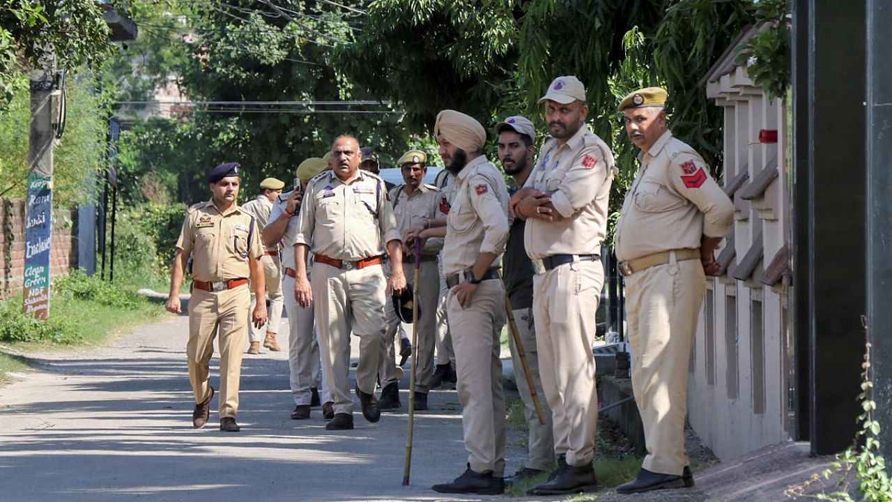 Jammu: Police personnel outside the residence of Jammu and Kashmir's Director General (Prisons) Hemant K. Lohia, on the outskirts of Jammu, Tuesday, Oct. 4, 2022. Lohia was found murdered at his residence late on Monday night. Credit: PTI Photo