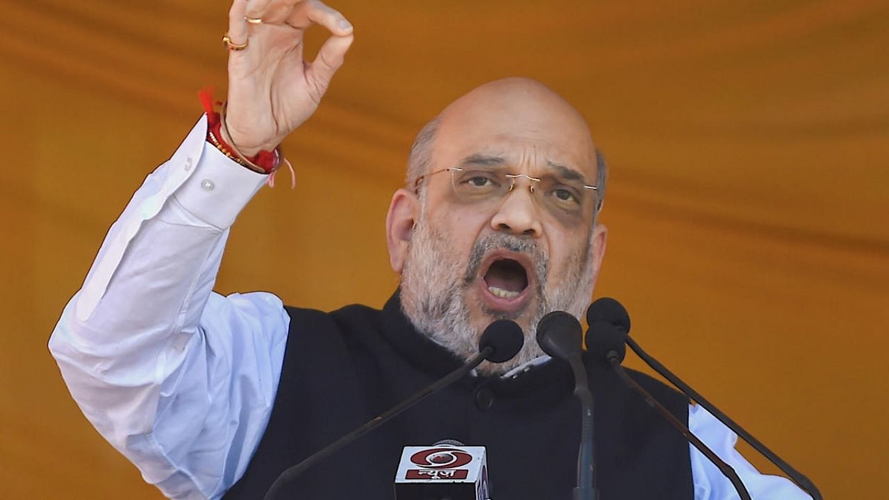 Union Home Minister Amit Shah addresses a public rally, at the Showkat Ali Stadium in Baramulla district of north Kashmir. Credit: PTI Photo