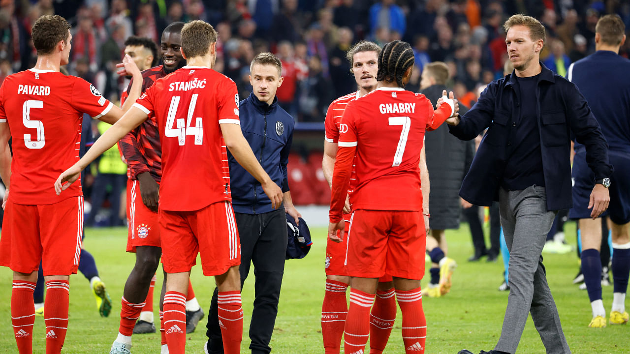 Bayern Munich coach Julian Nagelsmann celebrates with Serge Gnabry and teammates after the match. Credit: Reuters Photo