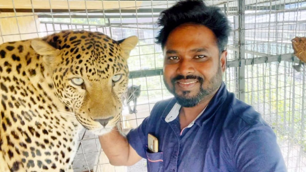 Gidikumar Patil, an orthopaedic doctor from Andhra Pradesh with his pet 'Yasha'. Credit: PTI Photo