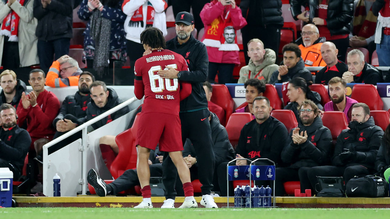 Liverpool's Trent Alexander-Arnold and manager Juergen Klopp celebrate after the match. Credit: Reuters Photo