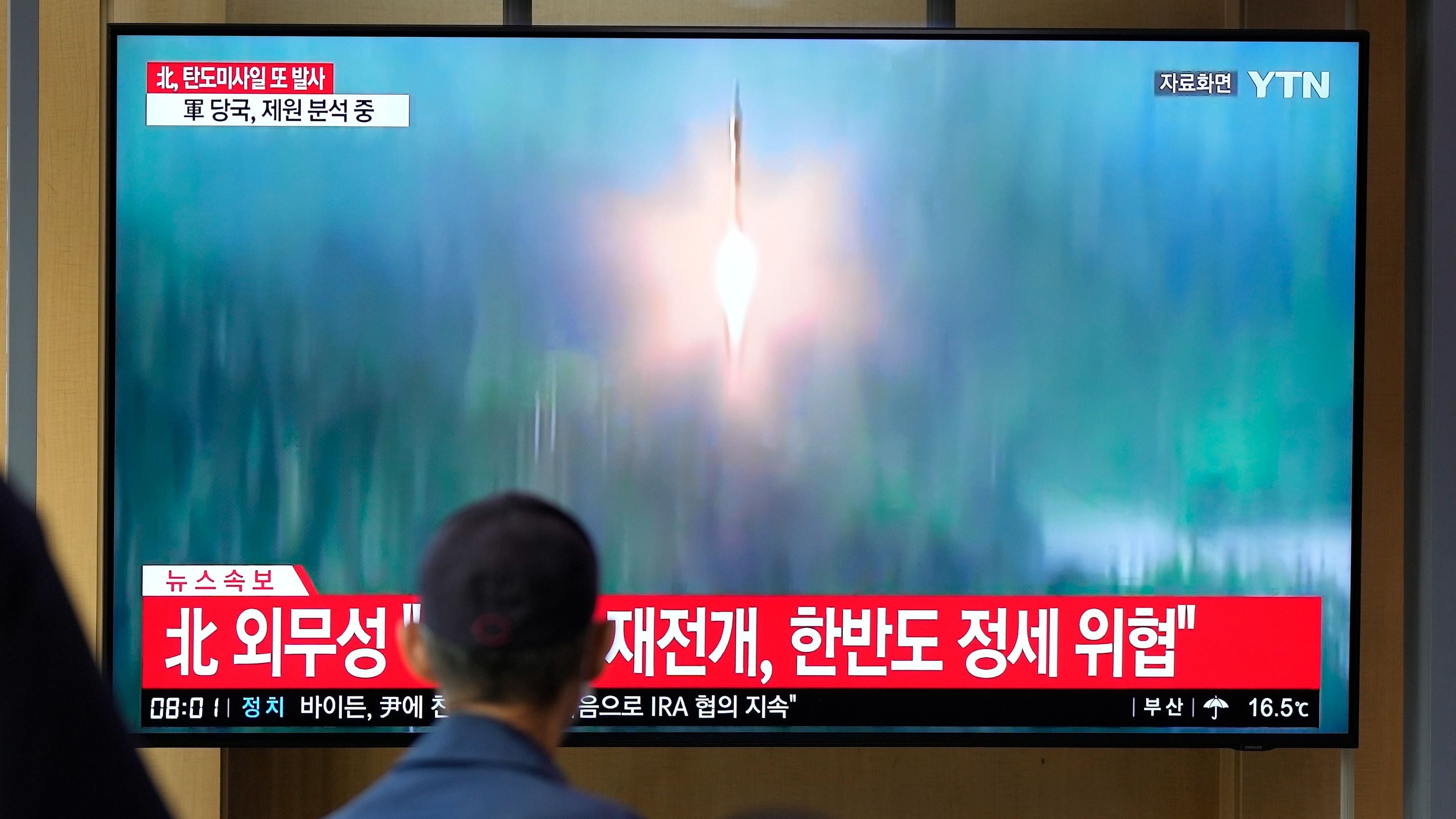 A TV screen showing a news program reporting about North Korea's missile launch with file footage. Credit: AP/ PTI Photo