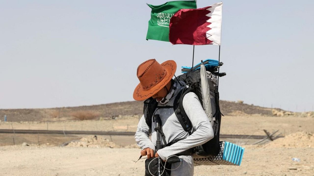 Saudi trekker Abdullah Alsulmi crosses a desert area near al-Khasrah area, some 350Km west of Riyadh. Credit: AFP Photo